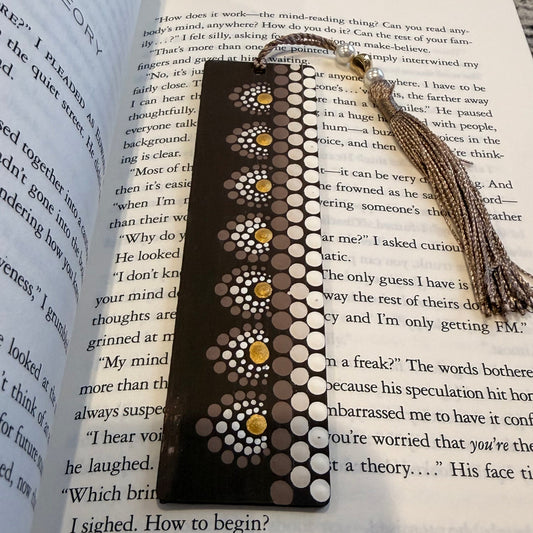 Decorative bookmark with tassel on an open book