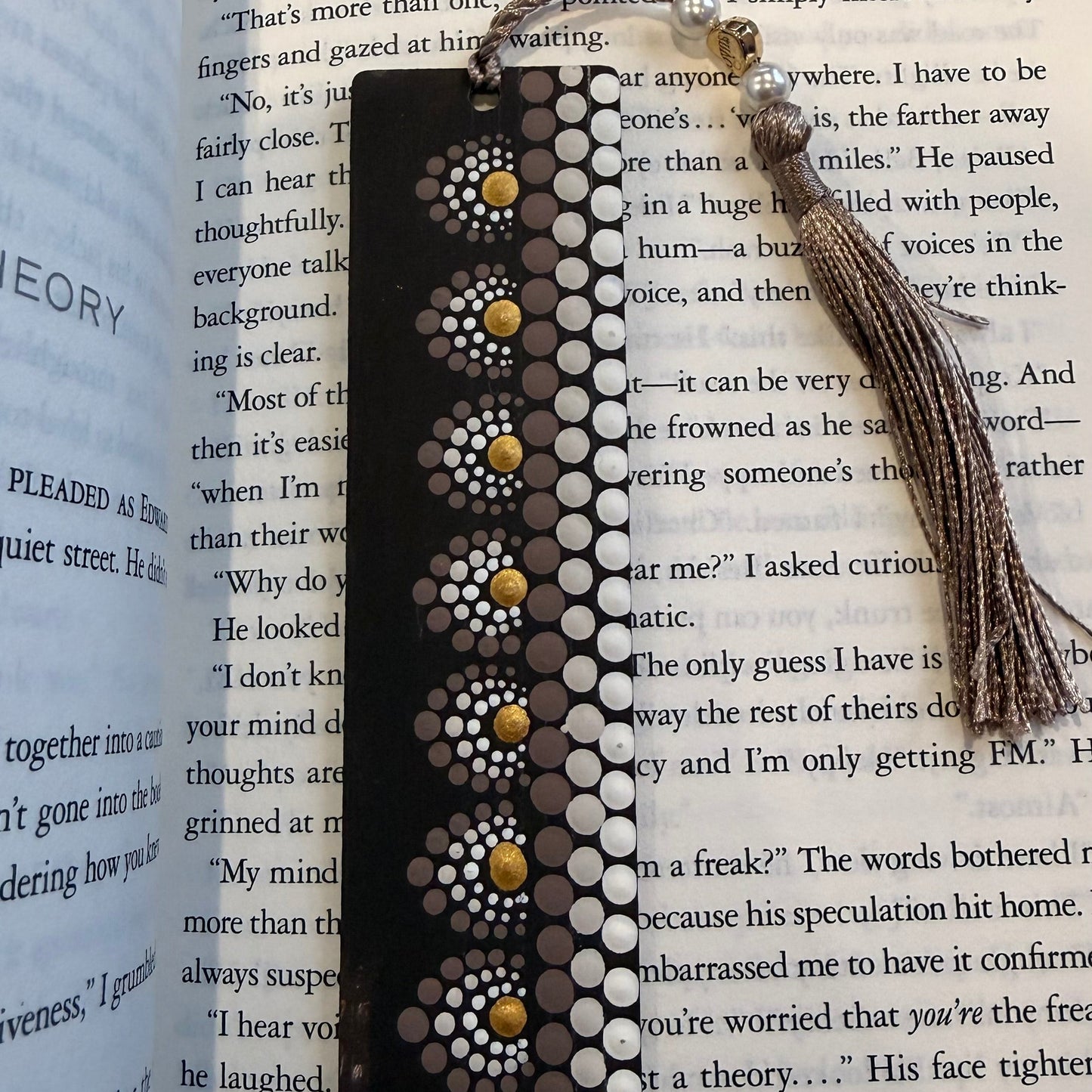 Decorative bookmarks with tassels on an open book