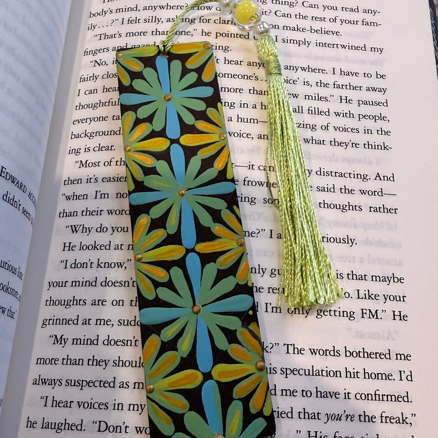 Decorative bookmark with a tassel on an open book