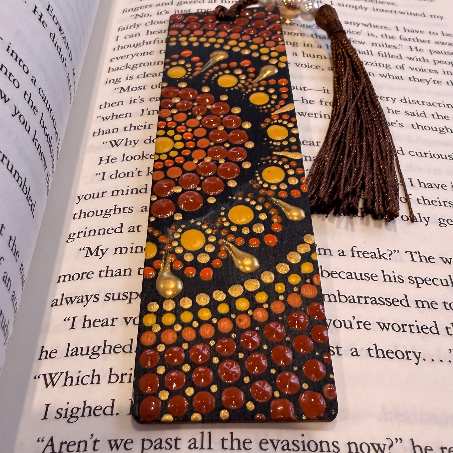 Decorative bookmark with tassel on an open book