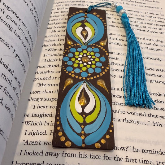 Decorative bookmark with tassel on an open book