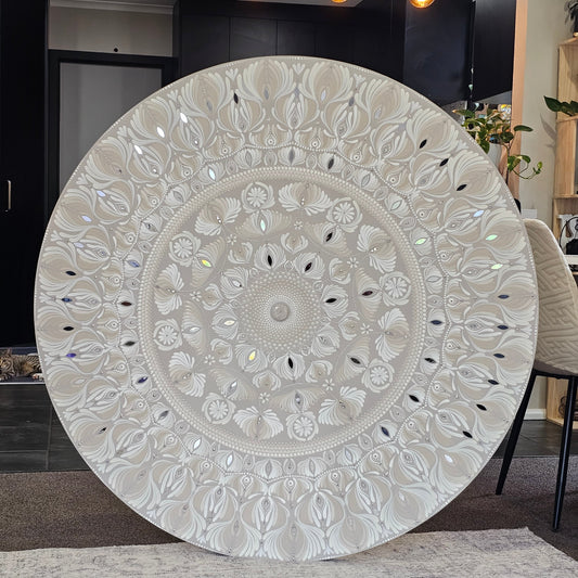 Decorative round rug with intricate patterns on a floor.