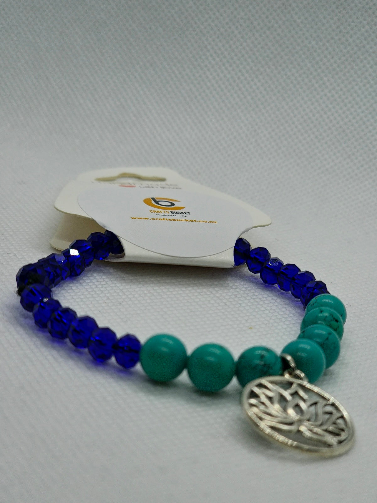 Lotus Charm: Turquoise & Navy Blue Stretch Bracelets
