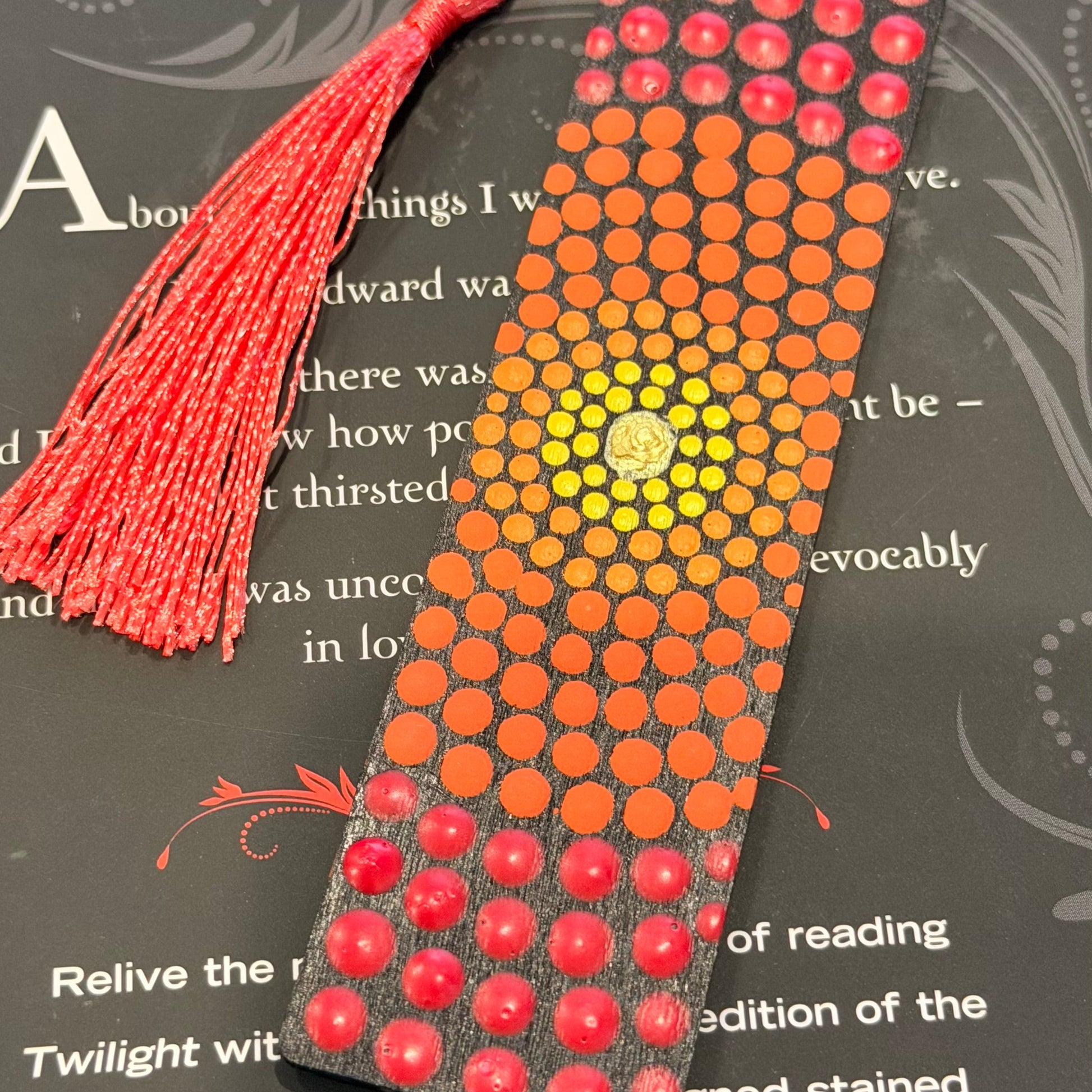 Decorative bookmark with beads and tassel on a book page