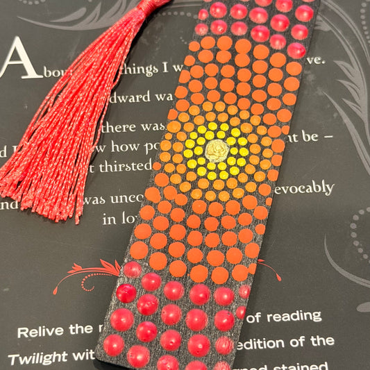 Decorative bookmark with beads and tassel on a book page