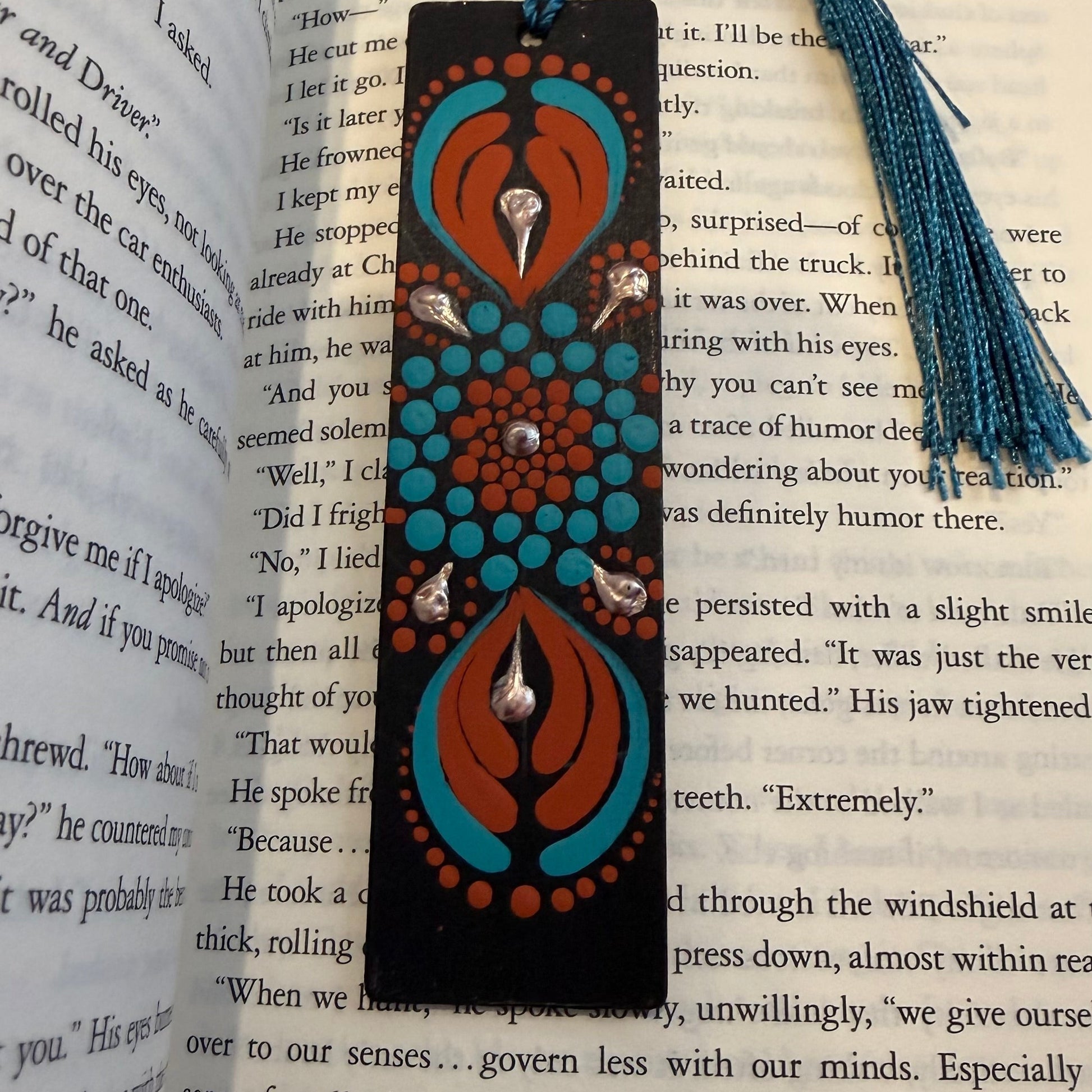 Decorative bookmark with tassel on an open book