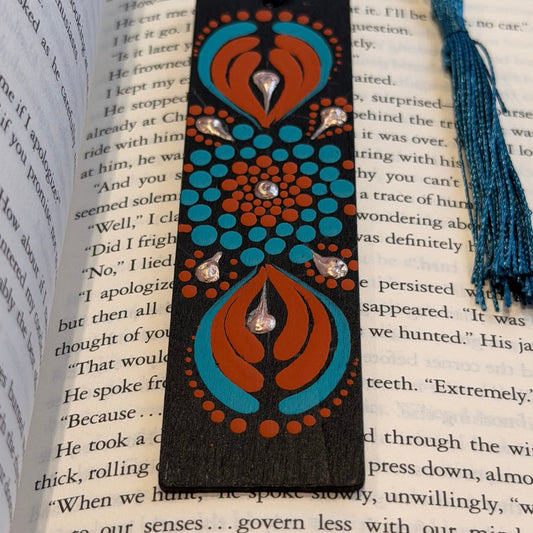 Decorative bookmark with tassel on an open book
