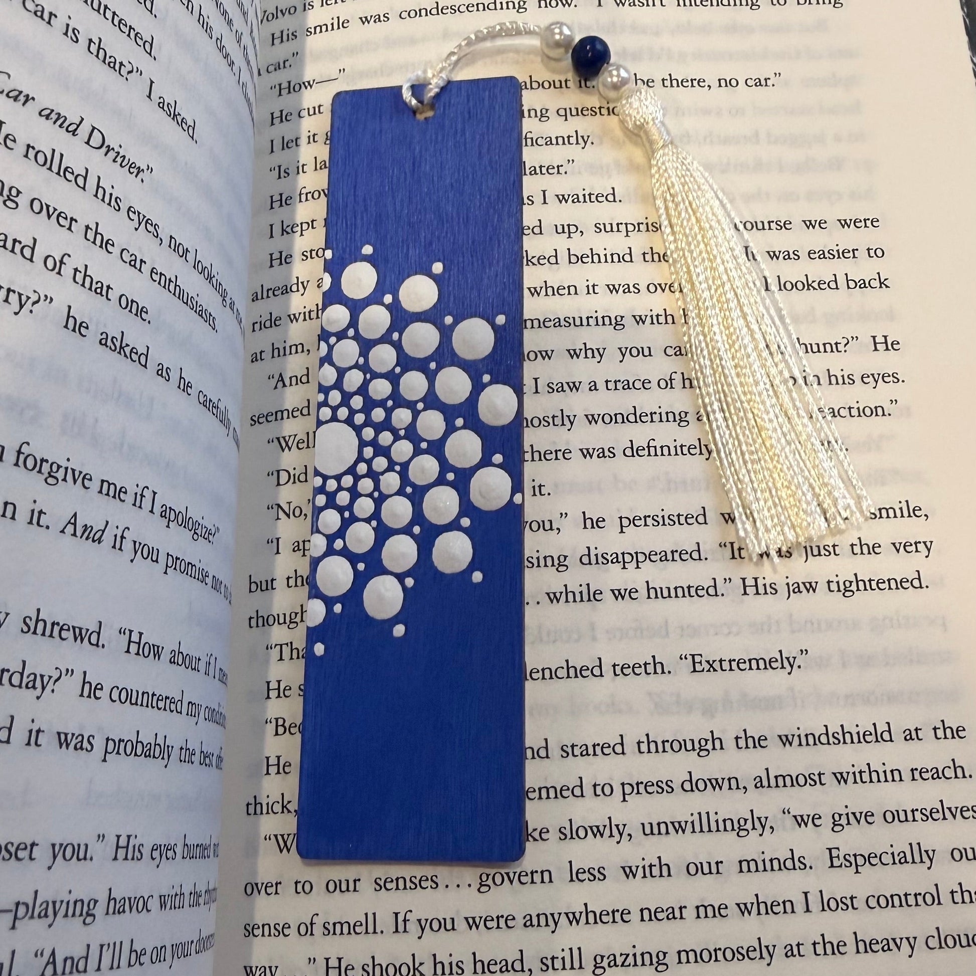 Crafts bucket Blue and white patterned wooden bookmark on an open book