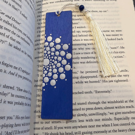 Crafts bucket Blue and white patterned wooden bookmark on an open book