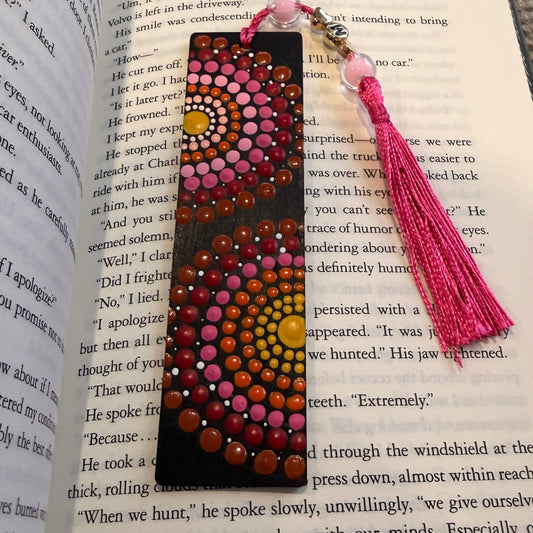 Decorative bookmark with tassel on an open book