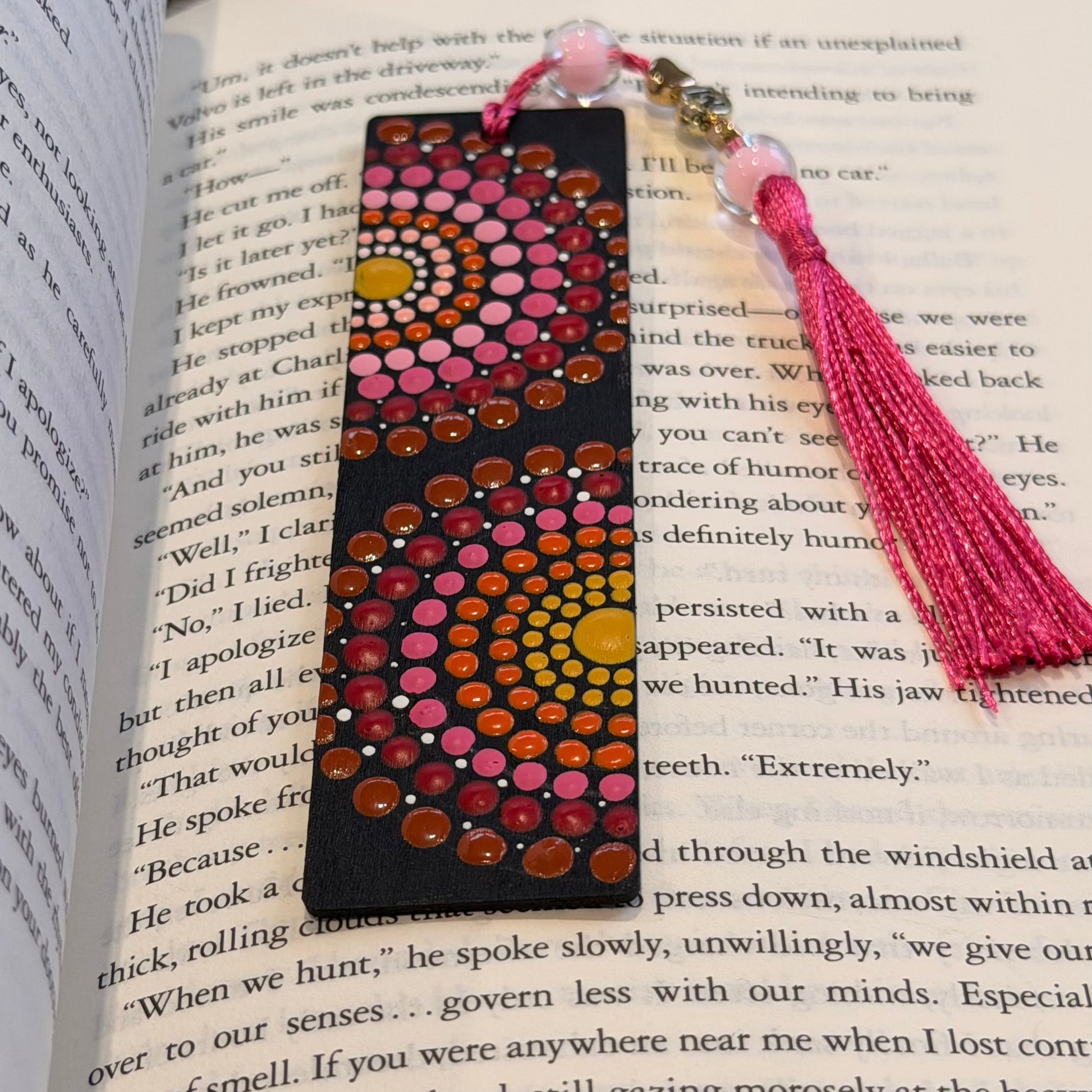 Decorative bookmark with tassel on an open book