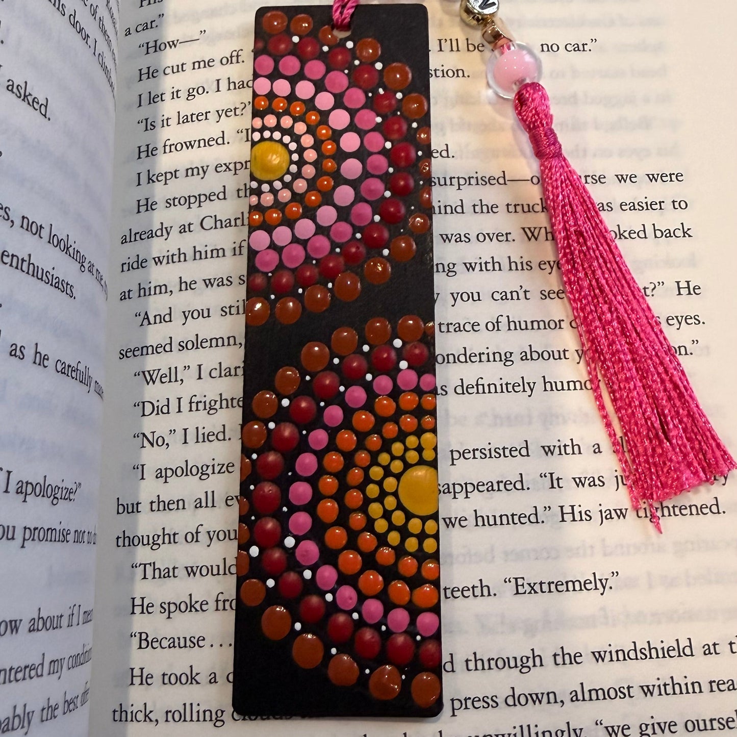 Decorative bookmark with tassel on an open book