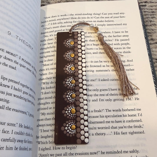 Decorative bookmark on an open book with a textured surface