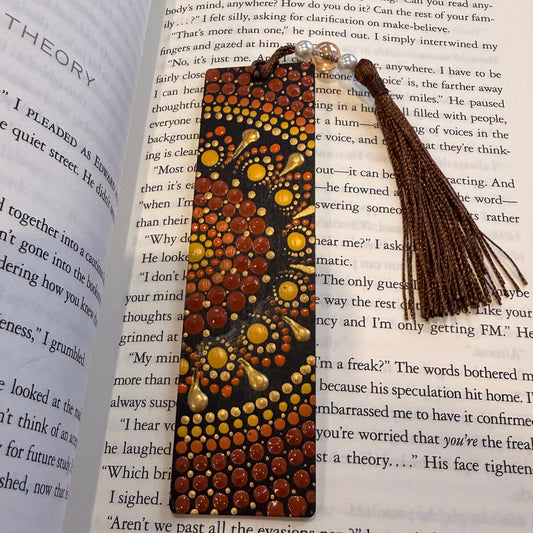 Decorative bookmark with tassel on an open book