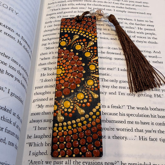 Decorative bookmark with tassel on an open book
