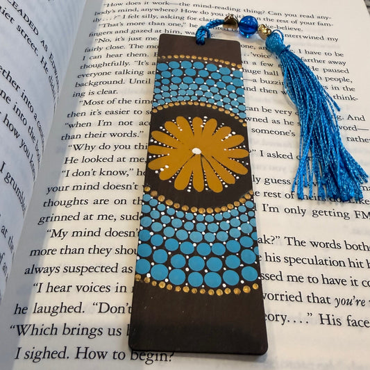 Decorative bookmark with tassel on an open book
