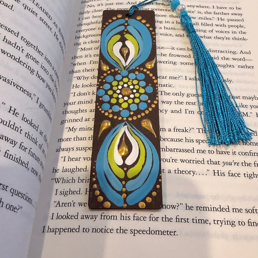 Decorative bookmark with tassel on an open book