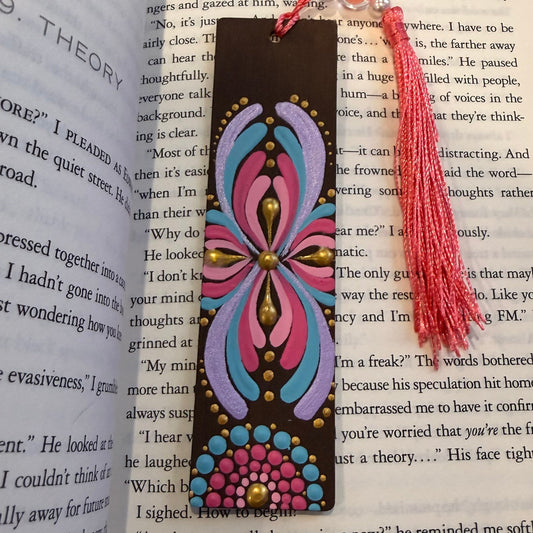 Decorative bookmark with tassel on an open book