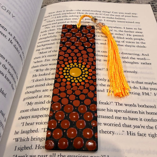 Decorative bookmark with beads and tassel on an open book