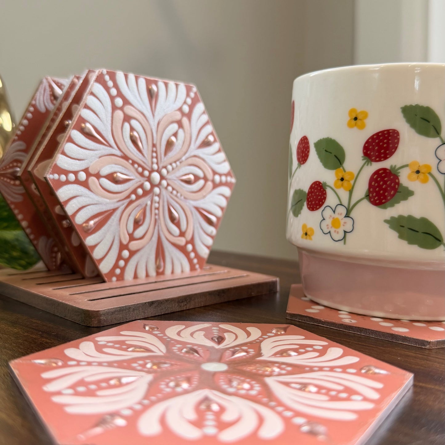 Decorative coasters with floral patterns on a wooden surface